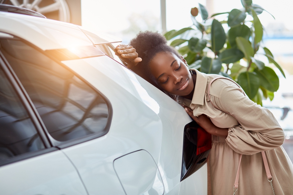 A woman is emotionally attached to her car